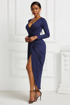 Navy ruched long-sleeve wrap dress, front view with asymmetric hem