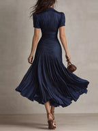 Navy striped midi dress, back view.