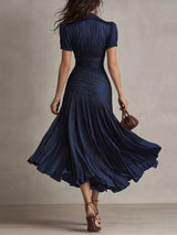 Navy striped midi dress, back view.