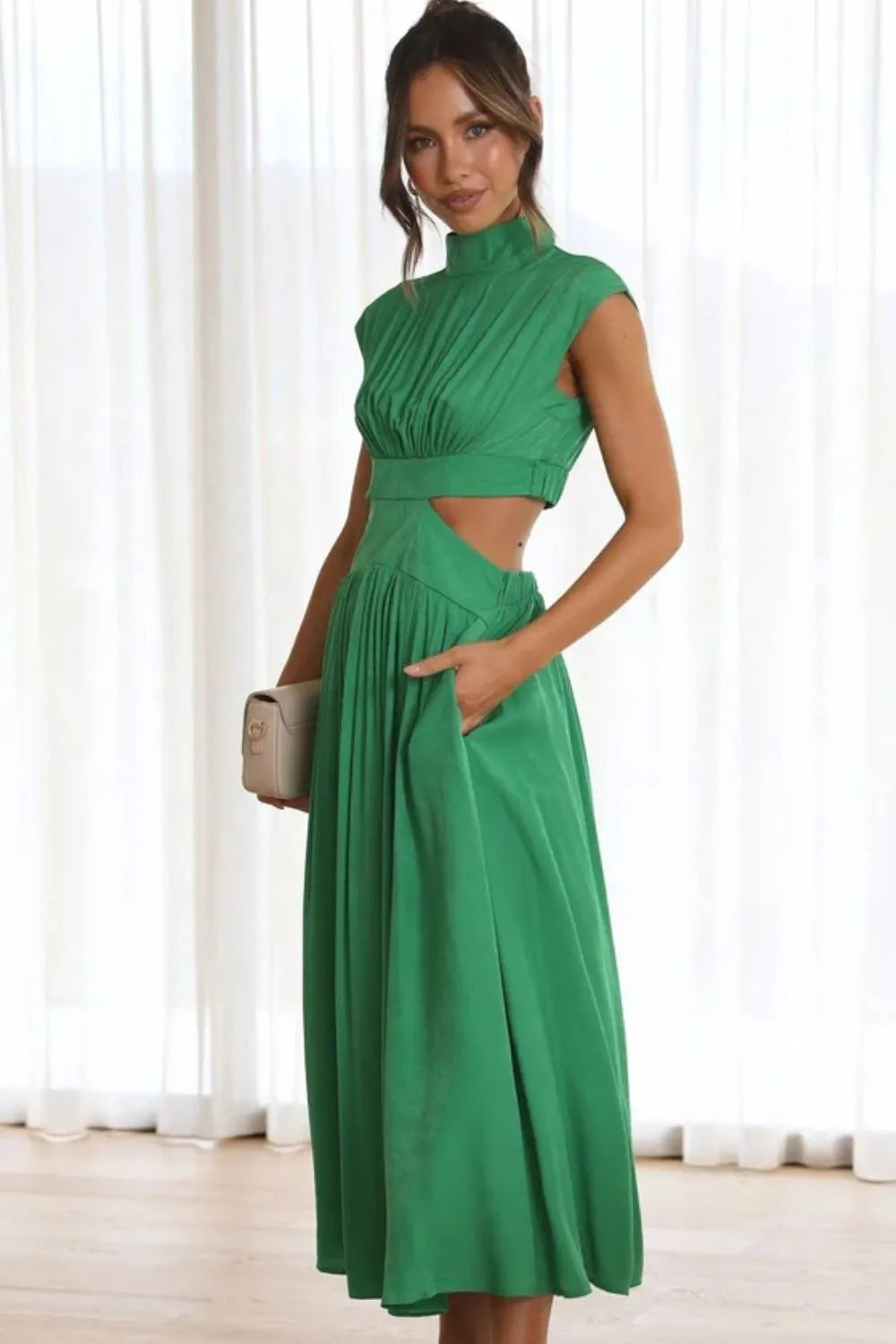 Sleeveless cutout ruched dress detail