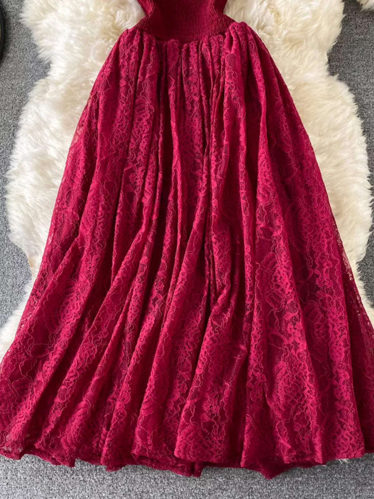 Burgundy ruffled mock-neck lace maxi dress, skirt detail.