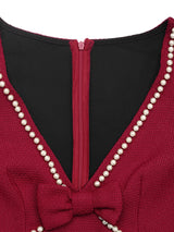 Red pearl-trim v-neck bodycon dress, neckline detail.