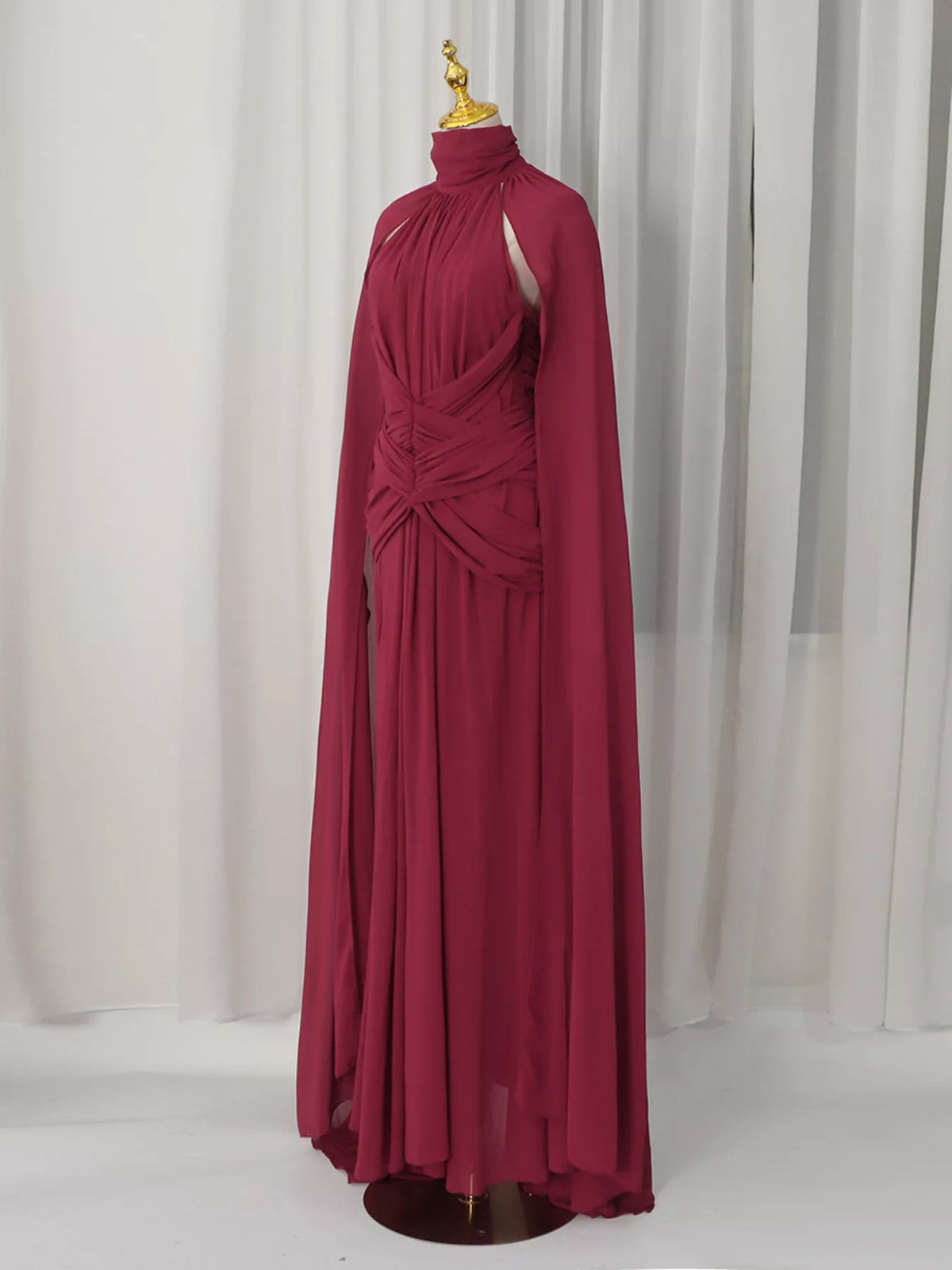 Burgundy ruched halter cape maxi dress, front view.