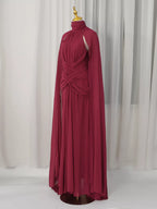 Burgundy ruched halter cape maxi dress, front view.