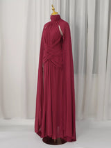 Burgundy ruched halter cape maxi dress, front view.