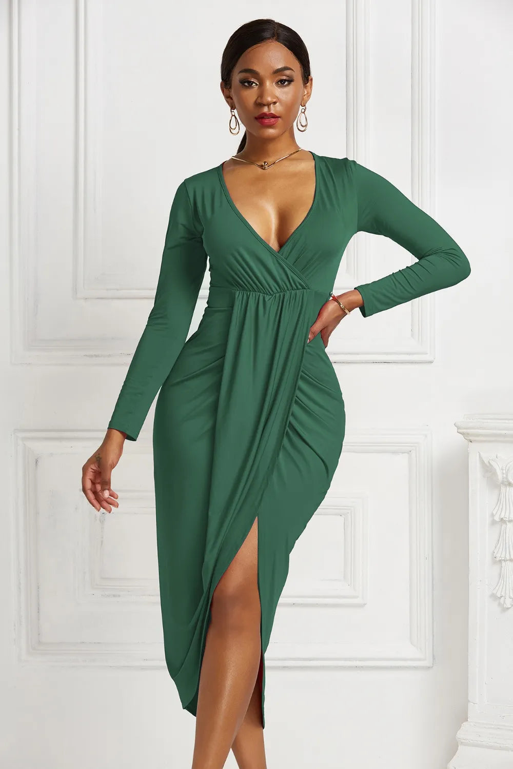 Green ruched long-sleeve wrap dress, front view with asymmetric hem