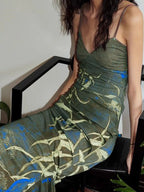 Green botanical-print spaghetti-strap maxi dress, seated front view