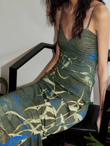 Green botanical-print spaghetti-strap maxi dress, seated front view