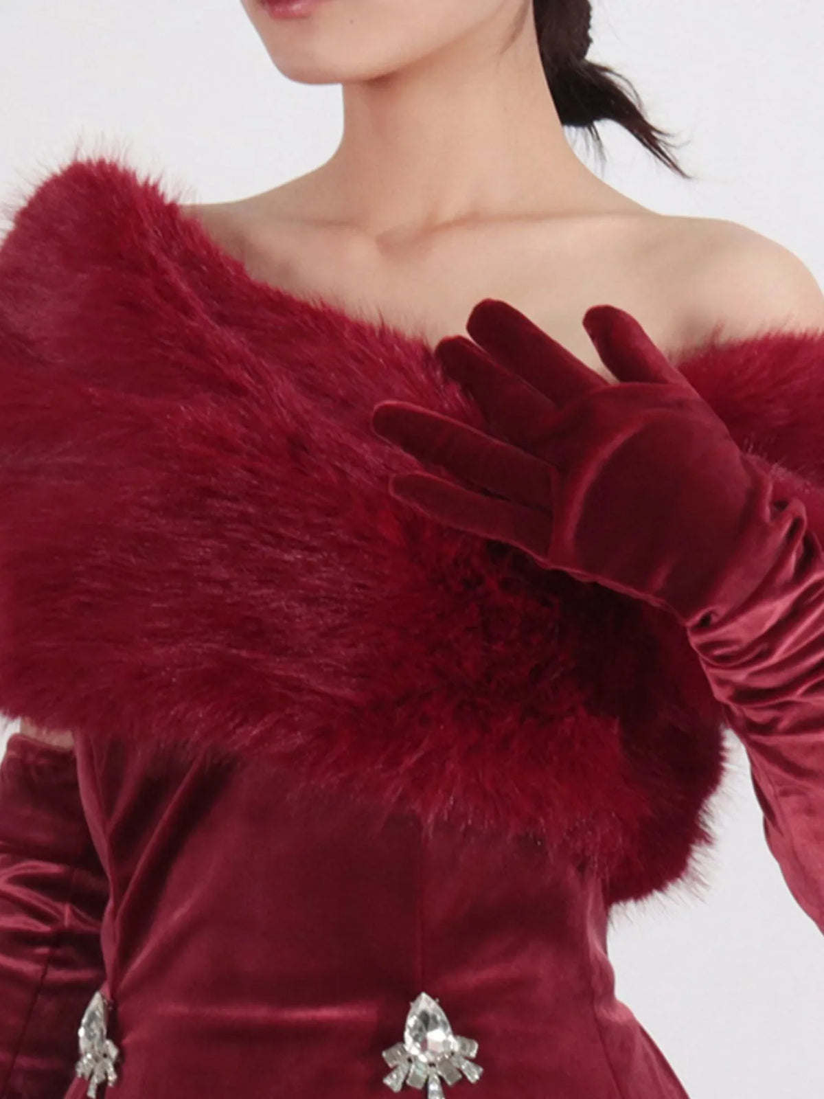Burgundy fuzzy off-the-shoulder rhinestone mini dress, neckline detail.