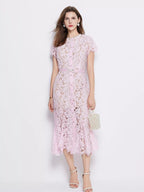 Pink short-sleeve lace mermaid midi dress, front view.
